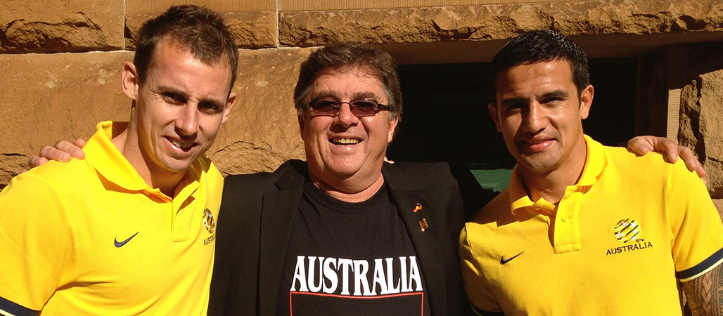 Professor John Maynard (centre) with Socceroos Luke Wilkshire and Tim Cahill (John Maynard)