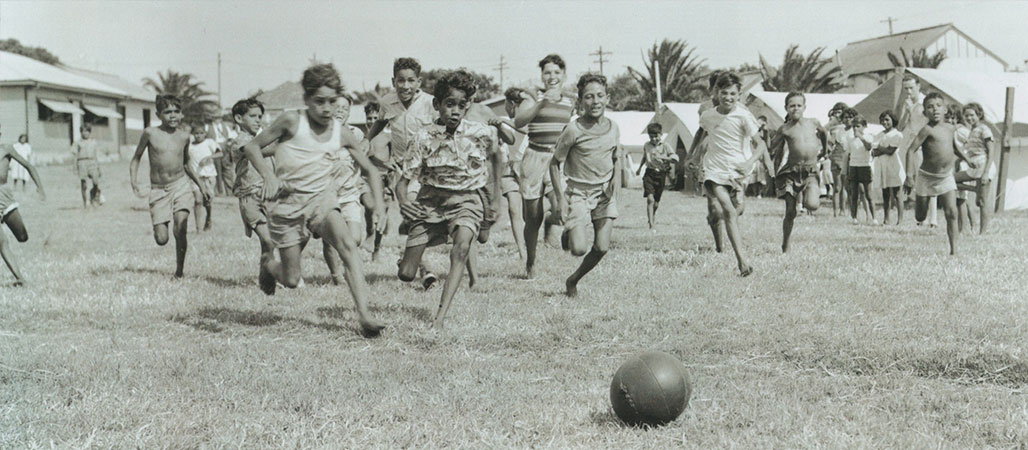 Group of young people playing soccer